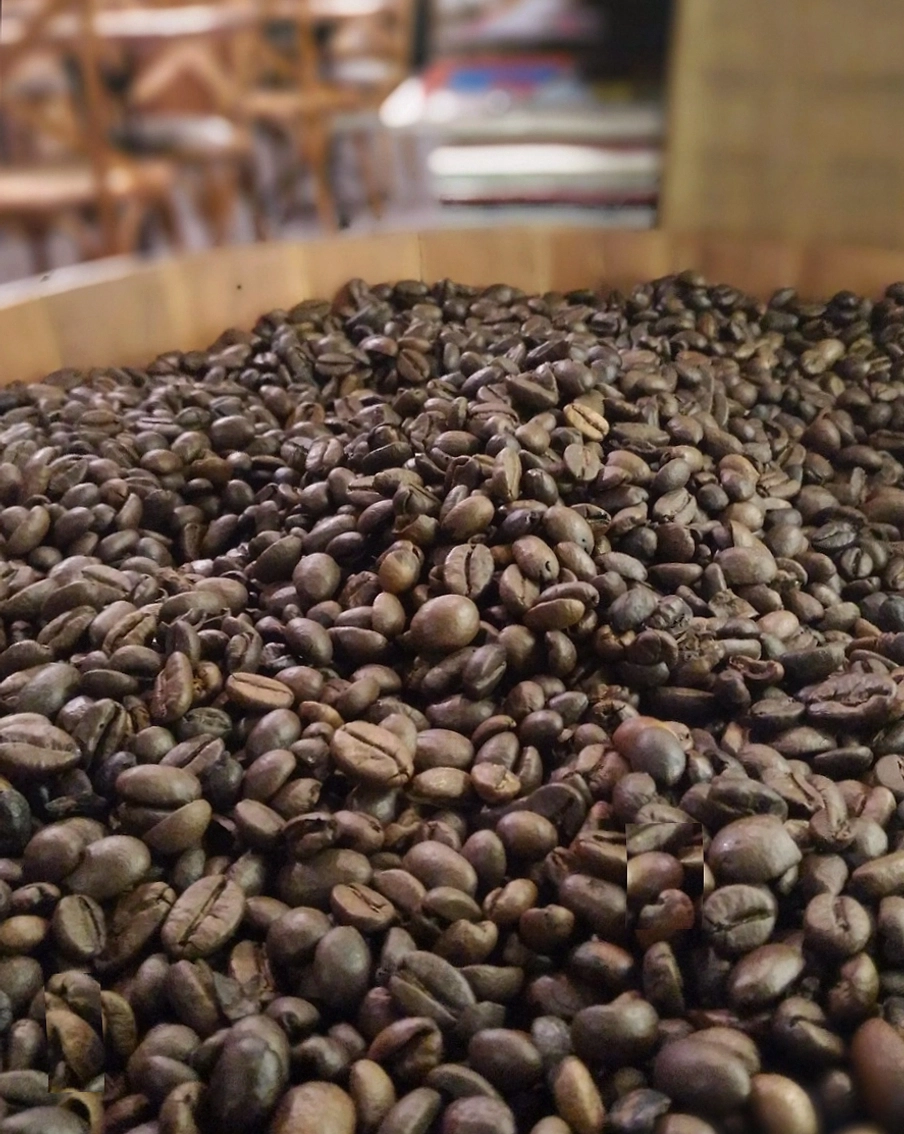 Communal table at the roastery café